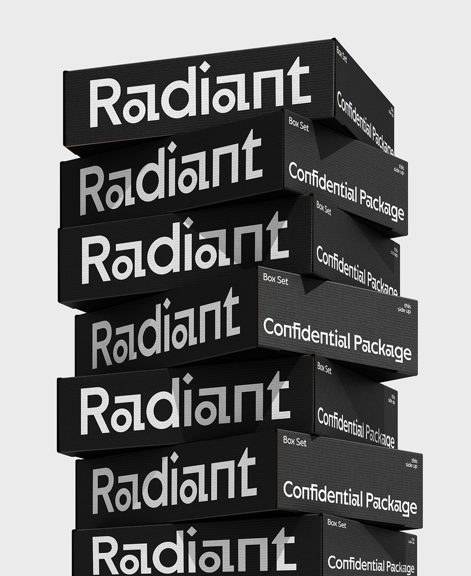 Neue Lunary Font geometric display sans-serif applied to luxury product packaging, showing brand mark "Radiant" in silver foil on black box set